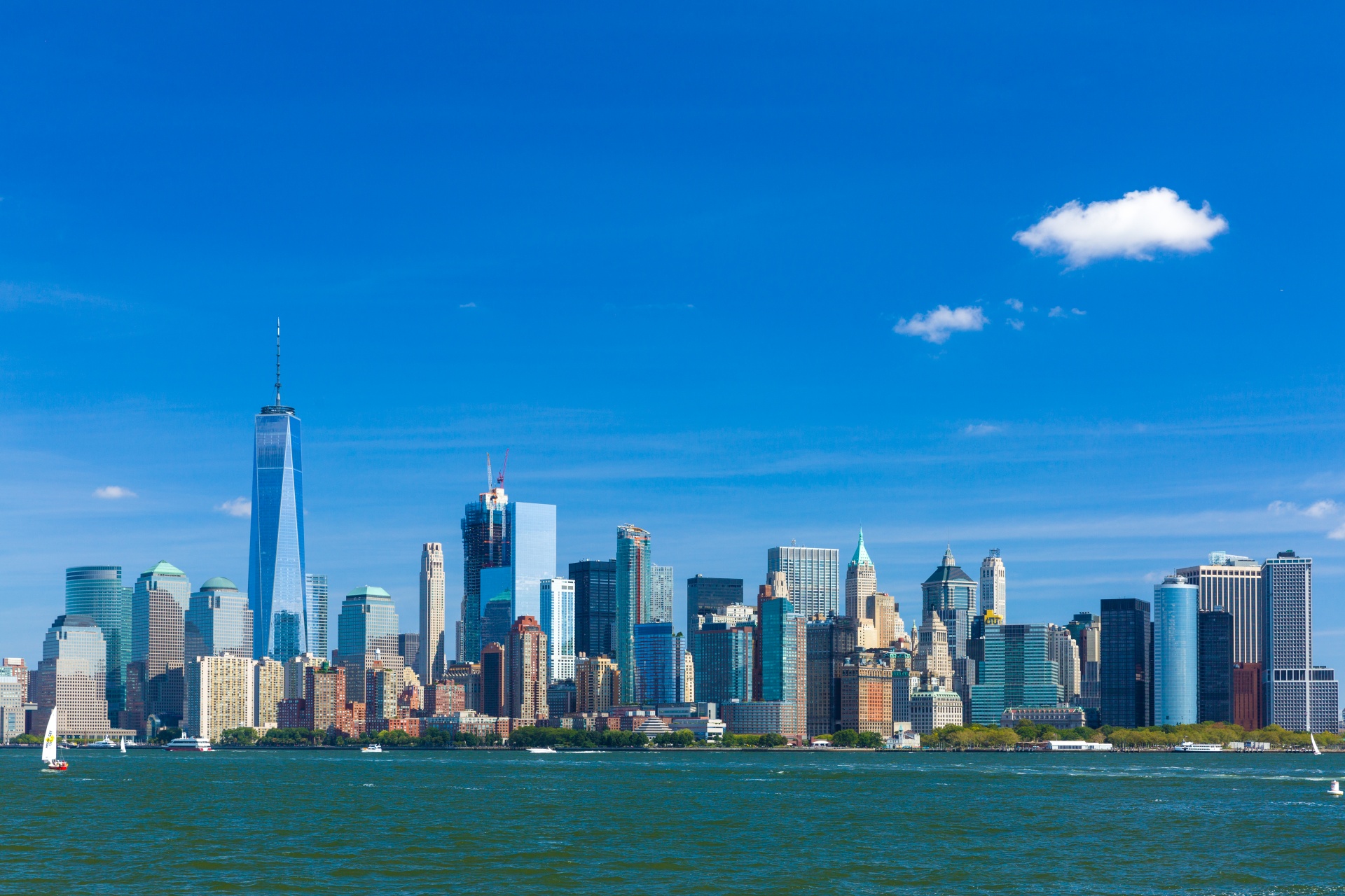 Manhattan's skyline rises across the water.
