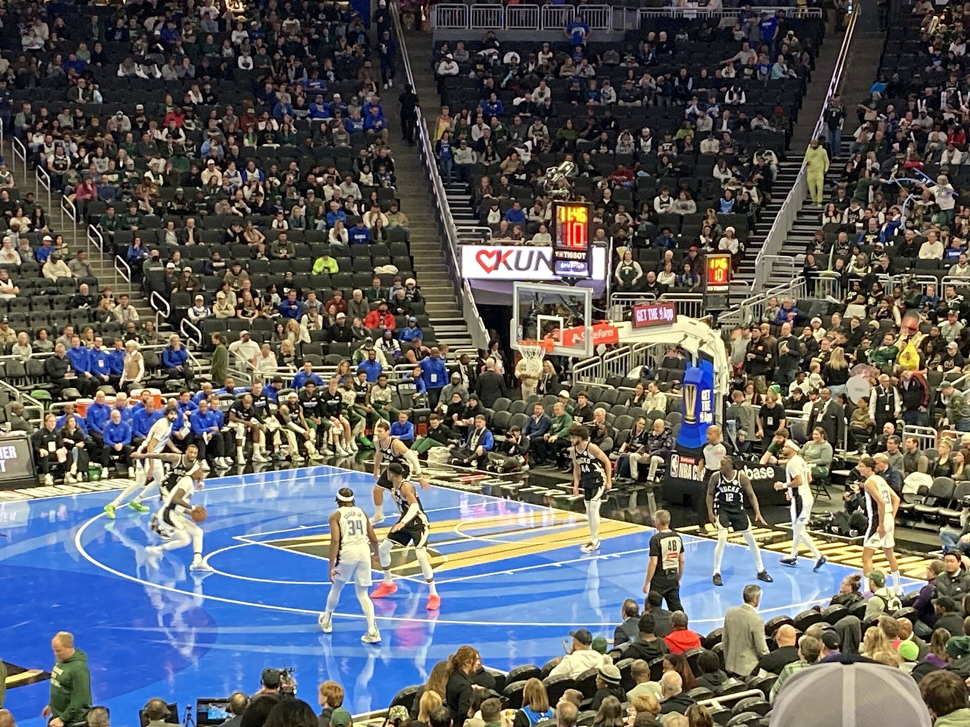 NBA players defending the basket during a Magic versus Bucks game